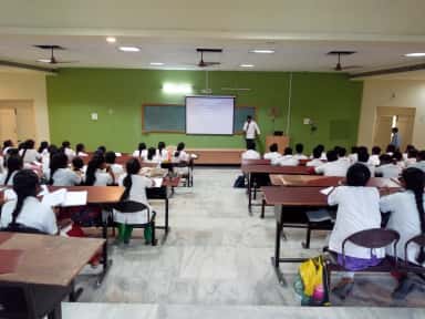 Students writing a university examination in a hall at Karpaga Vinayaga Institute of Medical Sciences