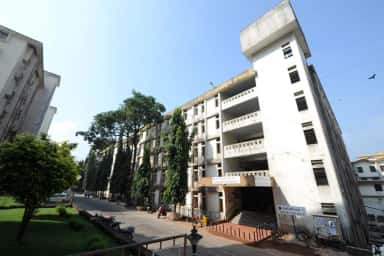 KMC Manipal boys' hostel blocks with the KMC Boys Hostels signboard