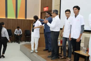 Academic felicitation event in the auditorium of Kiran Medical College, Surat