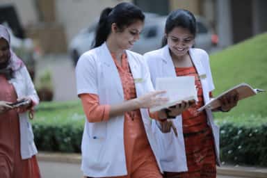 Junior doctors reading together on the lawns of KVG Medical College and Hospital, Sullia