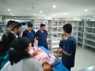 Faculty demonstrating airway management on a simulation manikin in the skill lab at Mahadevappa Rampure Medical College