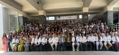 Graduating MBBS batch with faculty at the Mahadevappa Rampure Medical College graduation ceremony