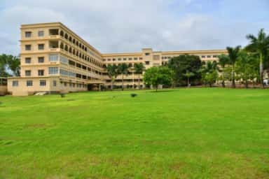 Open lawns in front of the MIMER Medical College building at Talegaon Dabhade