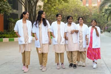 Medical students walking through the Mamata Academy of Medical Sciences campus at Bachupally
