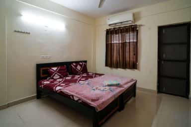 Air-conditioned twin-bed room in the girls' hostel at Mamata Academy of Medical Sciences