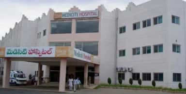 MediCiti Hospital building on the Ghanpur campus with its Telugu and English signage