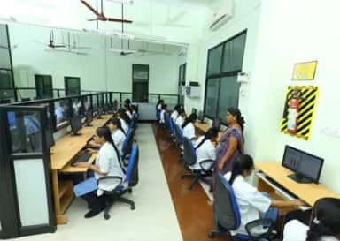 Students at workstations in the computer laboratory at MAPIMS Melmaruvathur