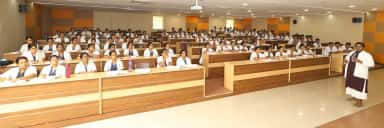 Tiered lecture theatre filled with MBBS students and a faculty member at MAPIMS Melmaruvathur