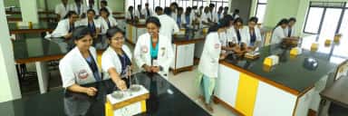 Students performing experiments in a brightly lit practical laboratory at MAPIMS Melmaruvathur