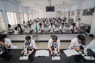 Students at microscopes during a practical session, Ramaiah Medical College, Bengaluru