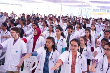 First-year MBBS students in white coats taking the oath at the Nova Institute of Medical Sciences white-coat ceremony
