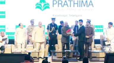 Stage of the Thalassemia and Sickle Cell centre inauguration at Prathima Institute of Medical Sciences with the college's name backdrop