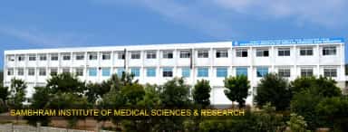 Sambhram Institute of Medical Sciences and Research college building at KGF with bilingual name board (archived college photo, 2024)