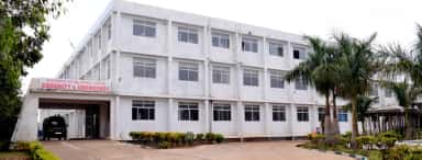 Casualty and Emergency block of Sambhram Hospital, KGF, with an ambulance at the porch (archived college photo, 2024)