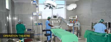 Operation theatre at Sambhram Hospital, KGF, with surgical lights and monitoring equipment (archived college photo, 2024)