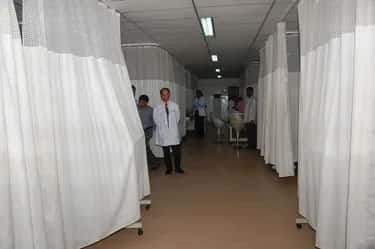 Curtained treatment bays in a ward corridor at Shadan Institute of Medical Sciences teaching hospital