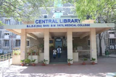 Central Library entrance of BLDE (DU) Shri B M Patil Medical College under shade trees
