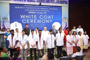 White Coat Ceremony for the MBBS 2025-26 batch in the hospital auditorium at Shridevi Institute of Medical Sciences Tumkur