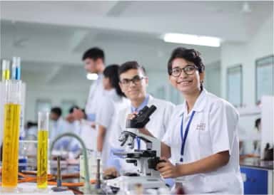 MBBS students working at microscopes in a laboratory at SMBT Institute of Medical Sciences, Nashik