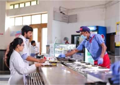 Students being served at the canteen counter on the SMBT Institute of Medical Sciences campus