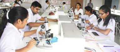 MBBS students working with microscopes in a laboratory practical at Smt. Kashibai Navale Medical College