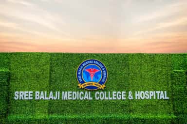 Sree Balaji Medical College & Hospital crest and name signage on the landscaped campus wall at Chromepet, Chennai