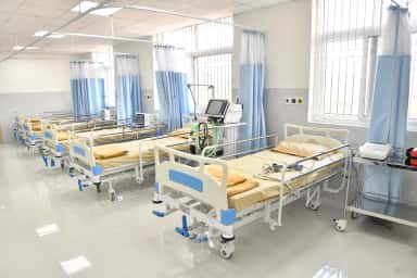 In-patient ward with beds and monitoring equipment at the SMSIMSR teaching hospital