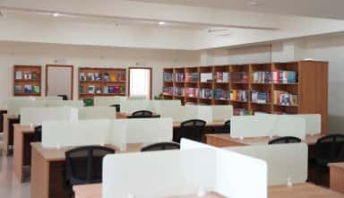 Reading desks and medical book stacks in the air-conditioned central library at SMSIMSR