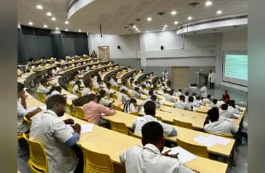 MBBS students attending a lecture in a gallery-style lecture theatre at SSIMSRC