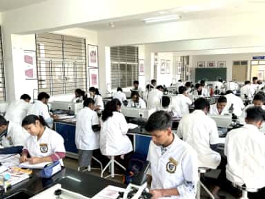Students at microscopes during a practical in the histology laboratory of SSIMSRC
