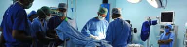 Surgical team at work in an operation theatre at Srinivas Hospital, Mukka