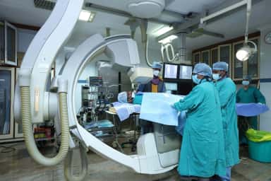 Cath lab with C-arm angiography equipment at SRM Medical College Hospital and Research Centre