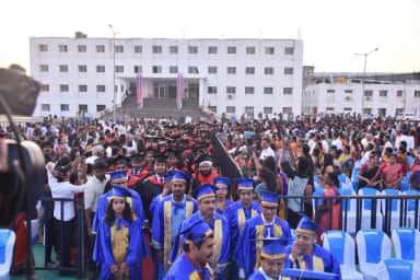 Graduating students and families gathered in front of the Subbaiah Institute of Medical Sciences buildings on convocation day