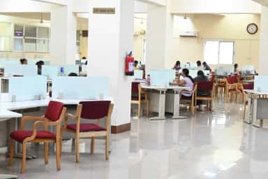 Students at reading desks in the central library staff reading section at Subbaiah Institute of Medical Sciences