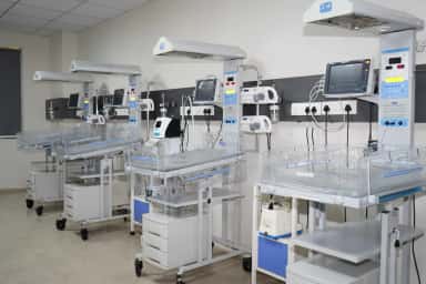 Neonatal intensive care unit with infant warmers at PSM Hospital, the teaching hospital of Swaminarayan Institute of Medical Sciences & Research, Kalol