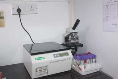 Blood-bank cross-matching bench with an ID-centrifuge and microscope at Tagore Medical College and Hospital