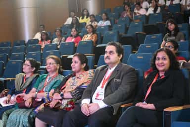 Faculty and delegates seated in the TERNA-branded auditorium during an academic event at Terna Medical College, Navi Mumbai
