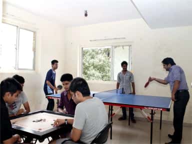 Hostel students playing table tennis and carrom in the recreation room at Terna Medical College, Navi Mumbai