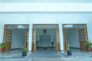 Main lobby and portico of VELS Medical College & Hospital with glazed doors
