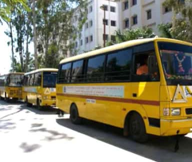 Campus building and college transport fleet at Vydehi Institute of Medical Sciences, Bangalore