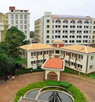 Aerial view of the Yenepoya University health-sciences campus buildings at Deralakatte, Mangalore