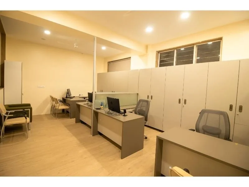 a room with desks and chairs — Dr. D. Y. Patil B-School