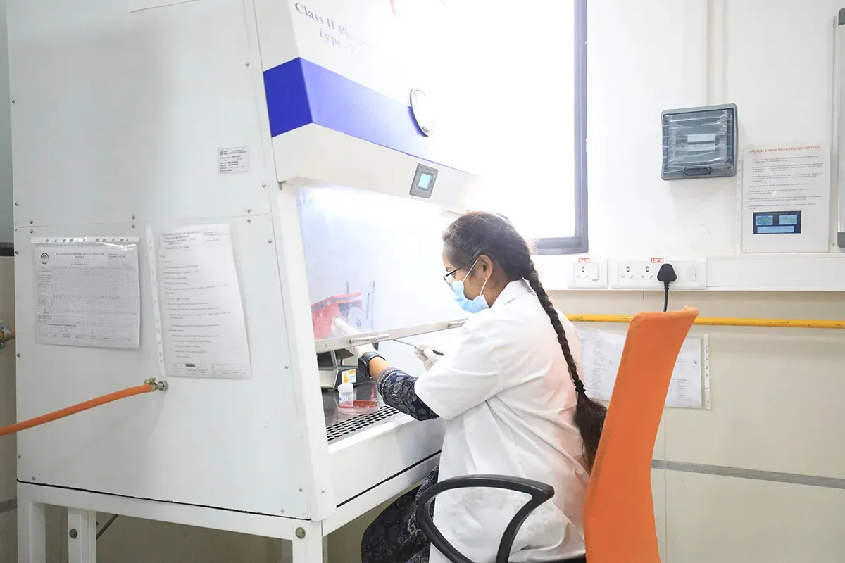 Lab work at a Class II biosafety cabinet at PES University Institute of Medical Sciences