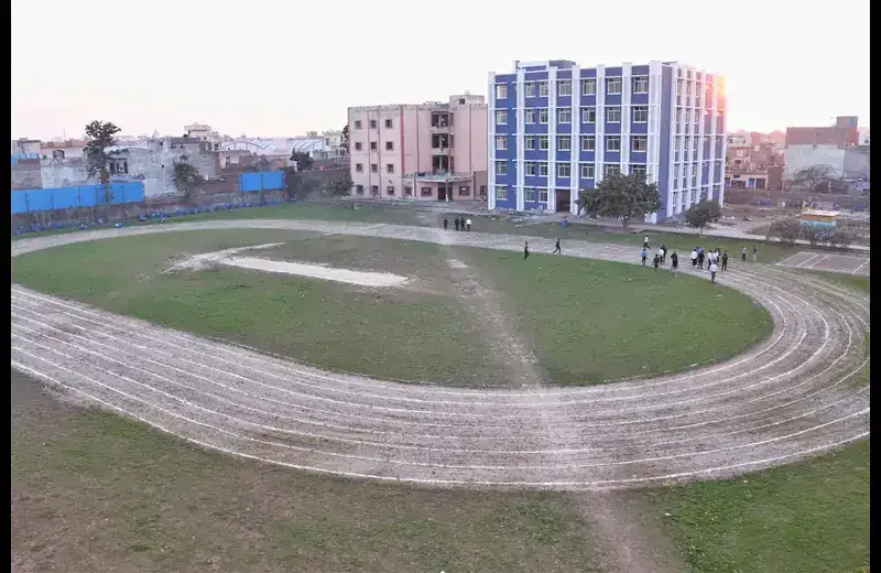 Campus ground with running track and academic buildings at IITM Murthal — International Institute of Technology and Management