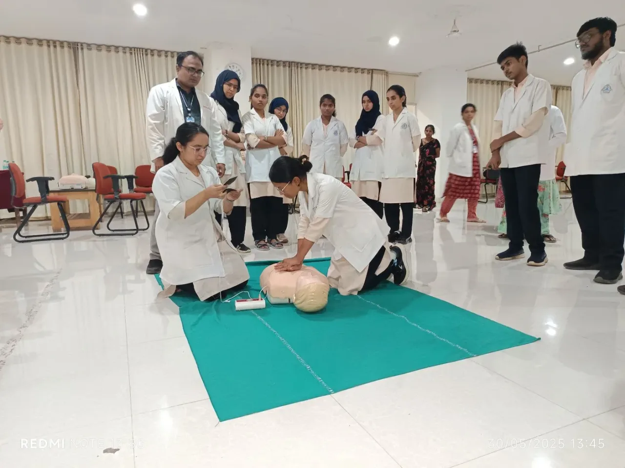 Students practising CPR on a manikin during ECLS skill-lab training at Mahadevappa Rampure Medical College Kalaburagi