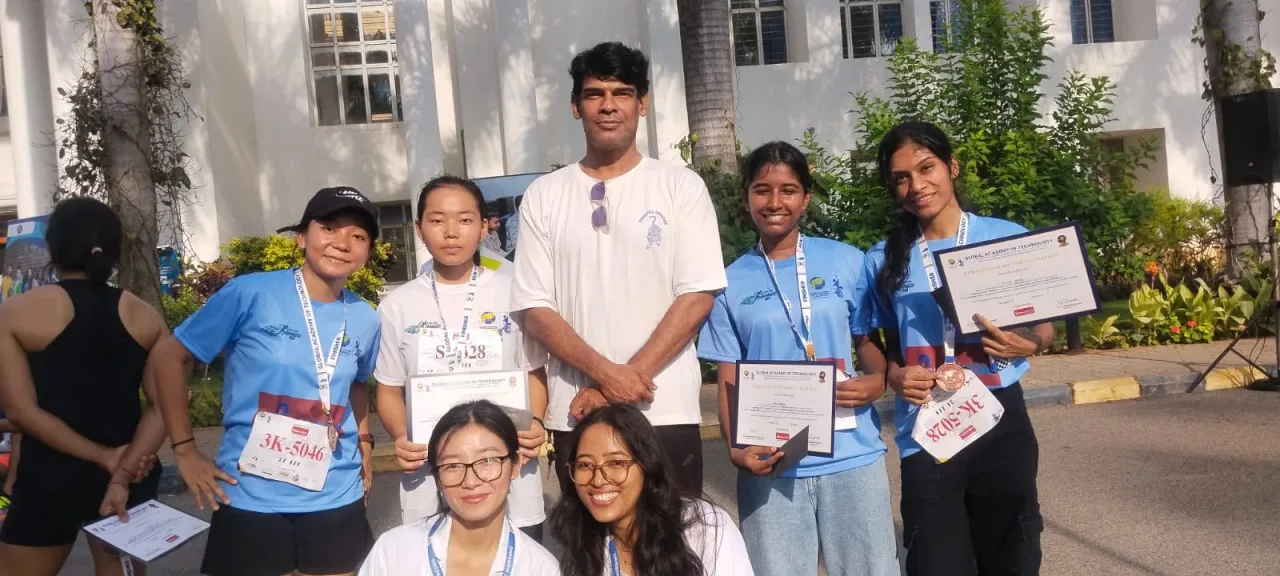Students displaying certificates after a college marathon event — Global College of Nursing