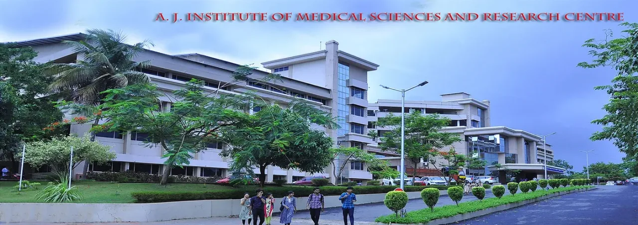 Students walking past the A J Institute of Medical Sciences and Research Centre building, Mangalore