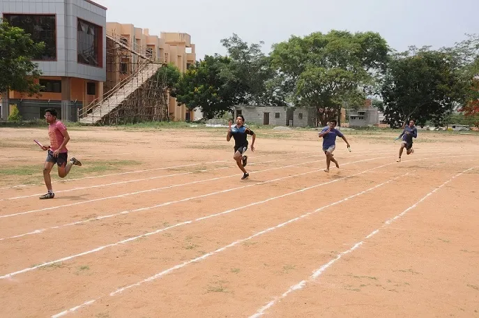 Students running a relay race on the JSS Medical College sports ground, Mysuru