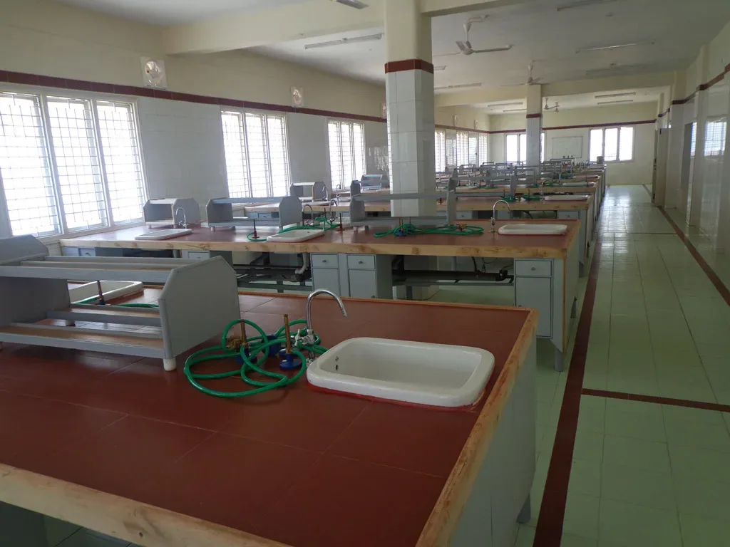 Physiology / biochemistry laboratory with sink-fitted work benches at Kamineni Academy of Medical Sciences, Hyderabad