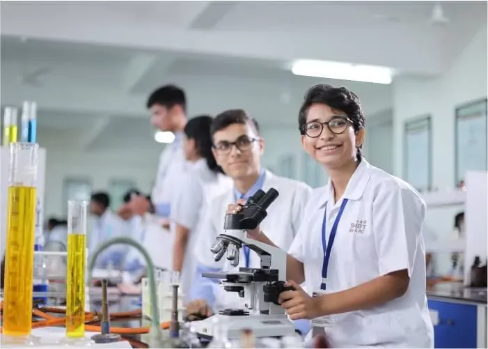 MBBS students working at microscopes in a laboratory at SMBT Institute of Medical Sciences, Nashik